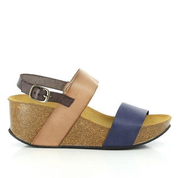 A captivating image showcasing Plakton's Blue and Tan Women's Wedge Sandals. The sleek design and adjustable straps exude sophistication, while the contrasting blue and tan colors add a pop of vibrancy. Crafted with premium vegan leather and a contoured cork footbed, these sandals offer both style and comfort for any occasion.