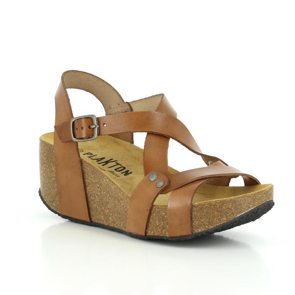 In this captivating image, Plakton's Brown Women's Wedge Sandals are showcased, emphasizing their chic design and earthy hue. The double cross-strapped front upper creates a diamond shape, while the adjustable ankle strap ensures a personalized fit. Crafted with premium leather and contoured cork footbed, these sandals offer both style and comfort. Perfect for adding a touch of sophistication to any smart-casual ensemble.