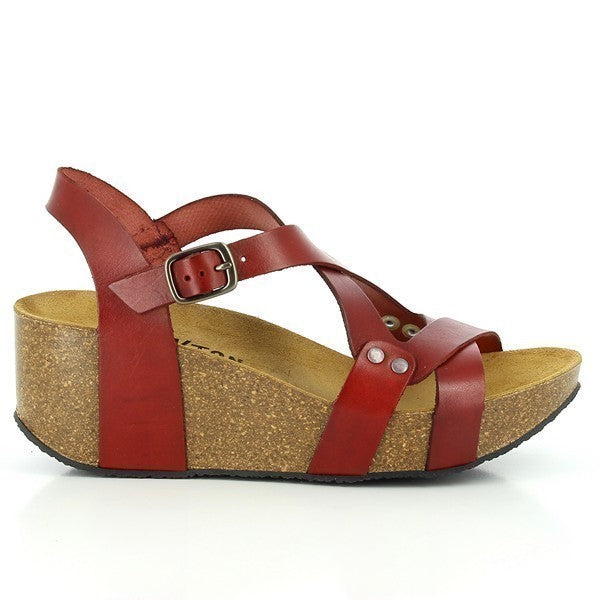 In this striking image, Plakton's Red Women's Wedge Sandals take center stage, showcasing their vibrant hue and stylish design. The double cross-strapped front upper creates a unique diamond shape, while the adjustable ankle strap ensures a perfect fit. Crafted with premium leather and contoured cork footbed, these sandals offer both comfort and sophistication. Perfect for elevating any smart-casual ensemble with a pop of color.