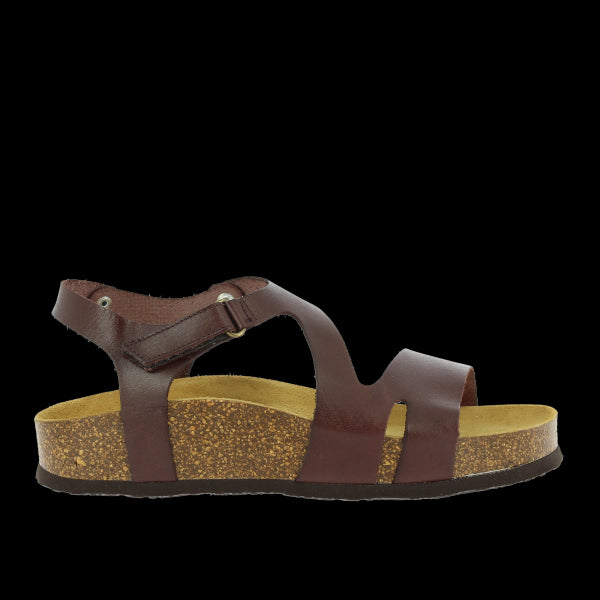 A striking image showcasing Plakton's Dark Brown Women's Sandals. Crafted with premium vegan leather, featuring an adjustable ankle strap for a personalized fit. The sleek design, coupled with contoured insoles and arch support, ensures all-day comfort and style. Perfect for adding a touch of sophistication to any summer ensemble.