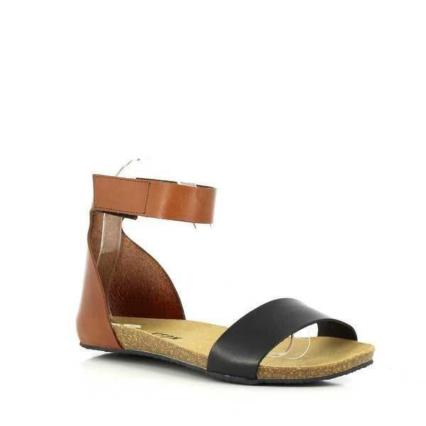 A captivating image showcasing Plakton's Black and Brown Women's Sandals. Crafted with soft leather uppers and featuring an anatomically contoured cork footbed, these sandals offer both style and comfort. The adjustable velcro ankle strap ensures a customized fit, making them perfect for all-day wear.