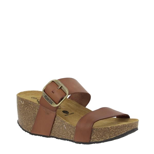 Behold the elegance of Plakton's 873004 Oak Women's Wedge Sandals from the external side. Crafted with precision, these vegan leather sandals feature adjustable straps and a 6.5cm cork wedge heel, ideal for elevating any outfit. The warm oak color adds a touch of sophistication to your look, while the memory cushion technology ensures all-day comfort. Made in Spain with premium materials, these sandals are a versatile addition to your wardrobe.