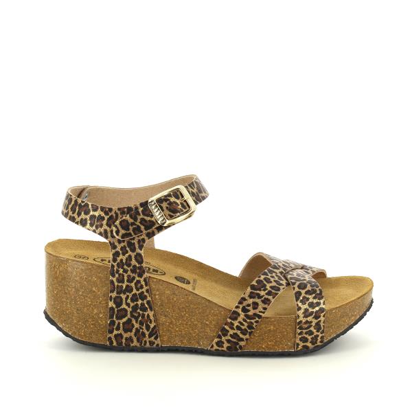  The photo showcases Plakton's 875087 Leopard Print Women's Wedge Sandals, exuding fierce elegance. The sleek cross-strap design adds a touch of sophistication, while the adjustable ankle strap ensures a secure fit. Crafted from premium vegan leather, these sandals boast superior quality and style. The 7cm wedge heel provides height with comfort, making them perfect for any occasion.